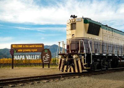 train on tracks in front of napa sign